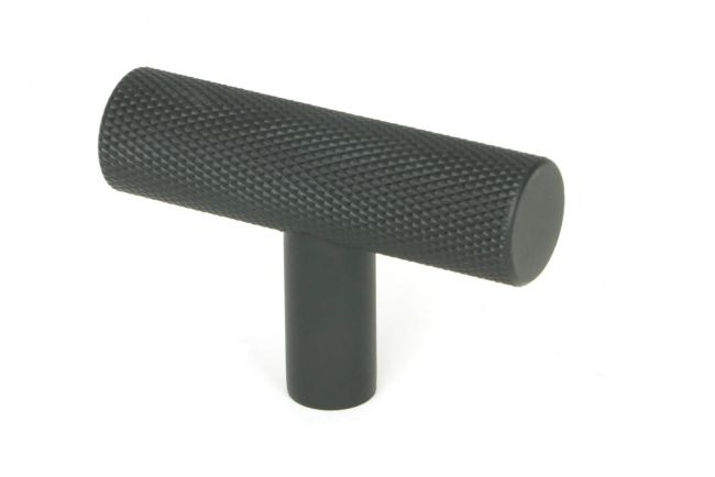 The Matt Black "Astor" Knurled Industrial T-Bar Cabinet Fitting shown on a White Background at an Angle 