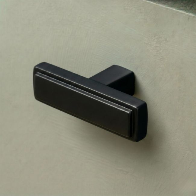 The "Emerson" Rectangular T-Bar Cabinet Pull Handle in a Matt Black Finish on a White Background Shown at an Angle The "Emerson" Rectangular T-Bar Cabinet Pull Handle in a Matt Black Finish on a White Background Shown at an Angle