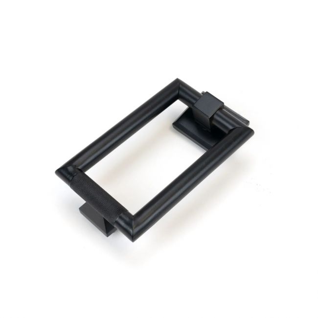 Modern Knurled Rectangular Door Knocker on a White Background Modern Knurled Rectangular Door Knocker on a White Background