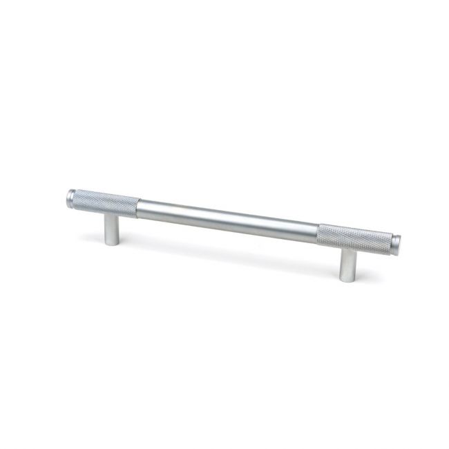 The Medium Half Knurled Cabinet Pull Handle in Satin Chrome Shown Upright on a White Background The Medium Half Knurled Cabinet Pull Handle in Satin Chrome Shown Upright on a White Background
