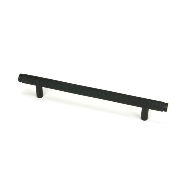 The Medium Knurled Cabinet Pull Handle in Matt Black Shown Upright on a White Background The Medium Knurled Cabinet Pull Handle in Matt Black Shown Upright on a White Background