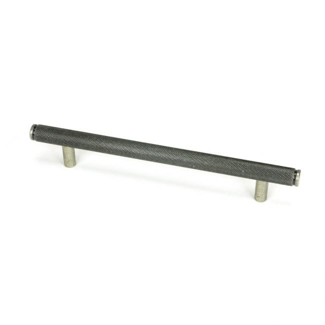 The Medium Knurled Cabinet Pull Handle in Pewter Shown Upright on a White Background The Medium Knurled Cabinet Pull Handle in Pewter Shown Upright on a White Background