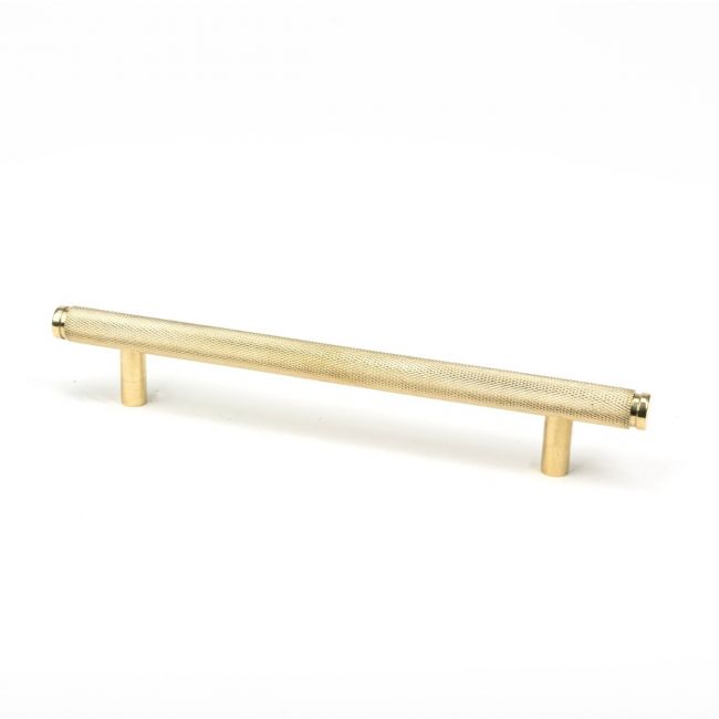 The Medium Knurled Cabinet Pull Handle in Polished Brass Shown Upright on a White Background