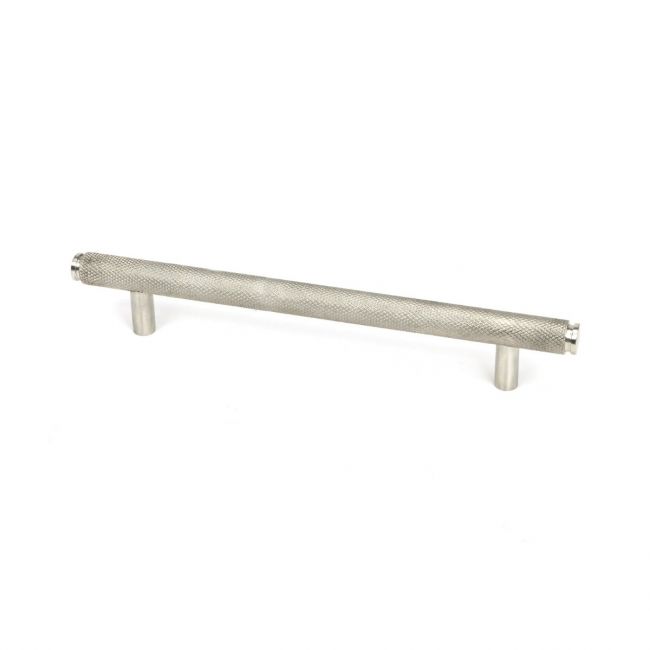 The Medium Knurled Cabinet Pull Handle in Satin Stainless Steel Shown Upright on a White Background The Medium Knurled Cabinet Pull Handle in Satin Stainless Steel Shown Upright on a White Background