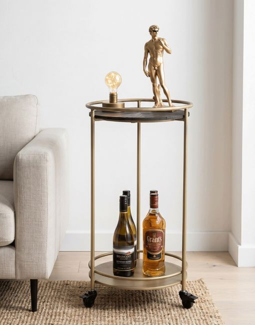The Metal & Wood Side Table on Wheels next to a Grey Sofa with Whisey and Wine Bottles Displayed on it - Digital Illustration