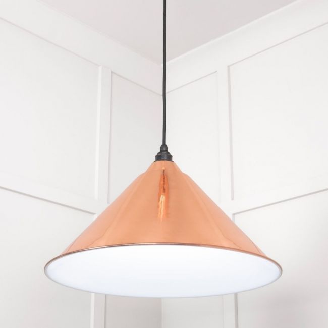 The Nidus Pendant Light in Copper and Glossy White Shown from a Low Angle
