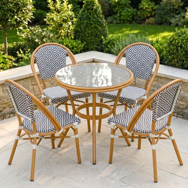 The Orbis Diamond 4-Seater Bistro Dining Set in Black & White in a Sunny Low Walled Garden