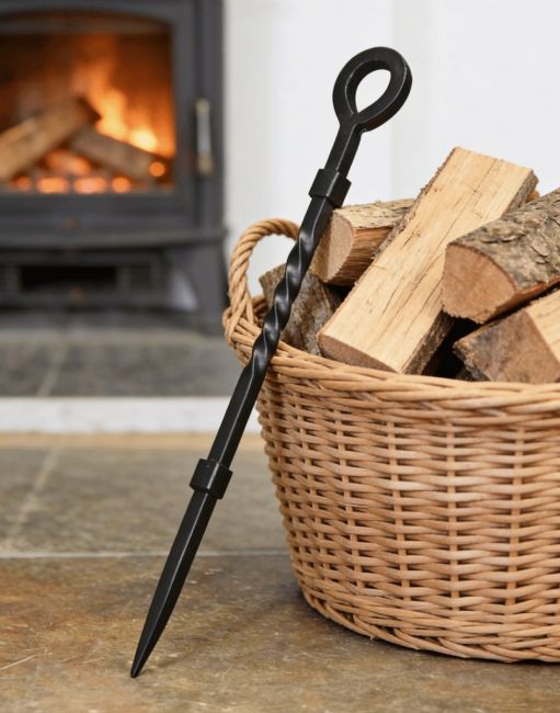 The “Pearson Place” Wrought Iron Fireside Poker Against a Log Basket in a Traditional Living Room - Digital Illustration The “Pearson Place” Wrought Iron Fireside Poker Against a Log Basket in a Traditional Living Room - Digital Illustration