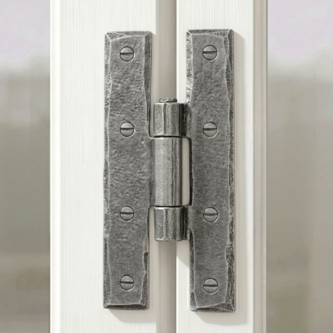 The Pewter 3¼" Inch H Hinge Pair Shown Attached to a Vintage White Window Frame in a Country Home - Digital Illustration 