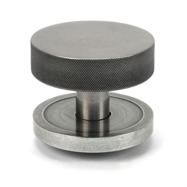 The Pewter Knurled Centre Door Knob on a Plain Rose Shown Upright on a White Background The Pewter Knurled Centre Door Knob on a Plain Rose Shown Upright on a White Background