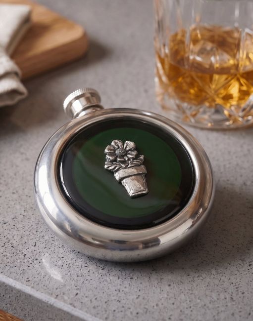 The Plant Pot Whiskey Flask on a Grey Kitchen Work Surface next to a Glass of Whisky - Digital Illustration The Plant Pot Whiskey Flask on a Grey Kitchen Work Surface next to a Glass of Whisky - Digital Illustration