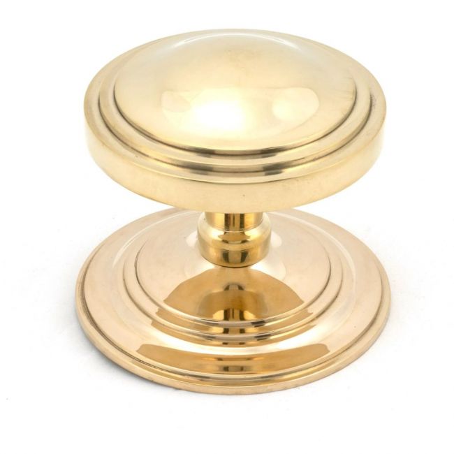 The Polished Brass Art Deco Stepped Centre Door Knob on a White Background The Polished Brass Art Deco Stepped Centre Door Knob on a White Background