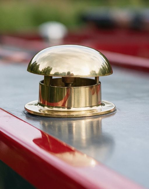 The Polished Brass Mushroom Vents Shown on the Top of a Canal Boat in a Countryside - Digital Illustration