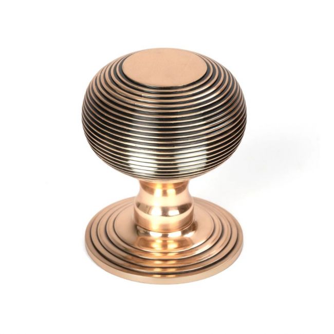 The Polished Bronze Traditional Beehive Centre Door Knob Shown Upright on a White Background 