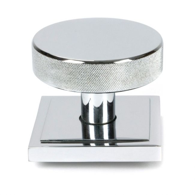 The Polished Chrome Knurled Centre Door Knob on Square Rose Shown Upright on a White Background The Polished Chrome Knurled Centre Door Knob on Square Rose Shown Upright on a White Background