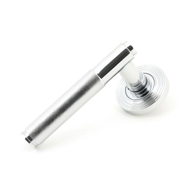 The Polished Chrome Knurled Lever on Beehive Rose Set on a White Background The Polished Chrome Knurled Lever on Beehive Rose Set on a White Background