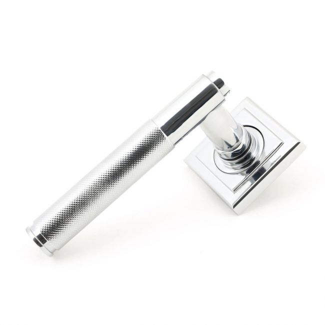 The Polished Chrome Knurled Lever on Square Rose Set on a White Background The Polished Chrome Knurled Lever on Square Rose Set on a White Background