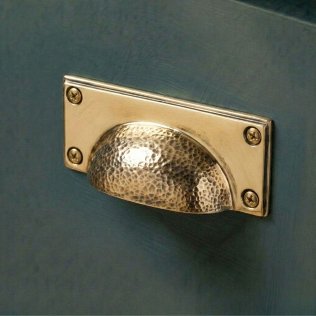 The Polished Copper Rectangular Drawer Pull with Curved Hammered Handle Mounted on a Contemporary Kitchen Cupboard Drawer - Digital Illustration The Polished Copper Rectangular Drawer Pull with Curved Hammered Handle Mounted on a Contemporary Kitchen Cupboard Drawer - Digital Illustration