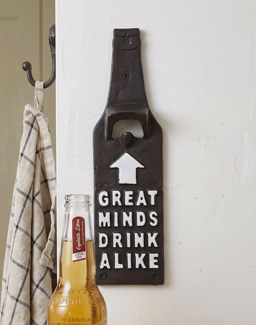The Quirky Bottle-Shaped Iron Bottle Opener Mounted on Wall next to a Beer with the Message Great Minds Drink Alike - Digital Illustration The Quirky Bottle-Shaped Iron Bottle Opener Mounted on Wall next to a Beer with the Message Great Minds Drink Alike - Digital Illustration