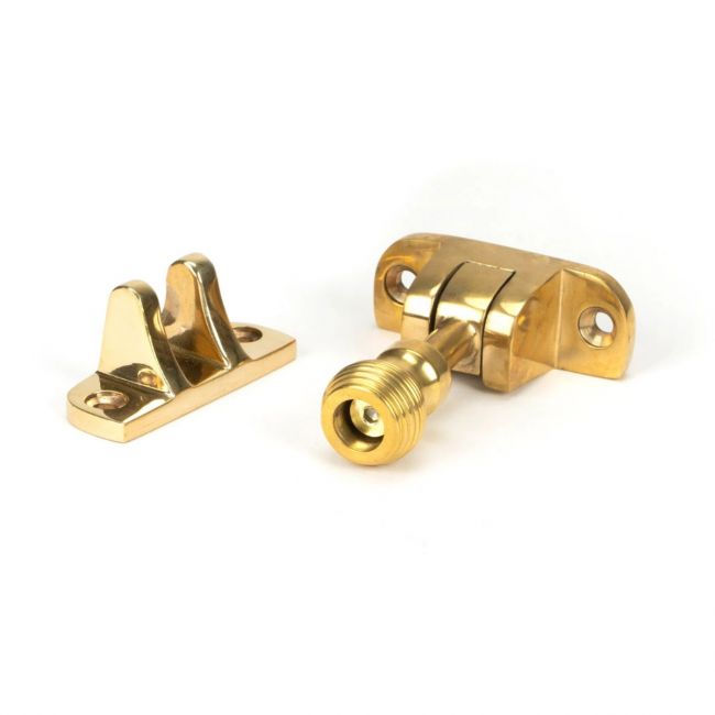 The Radiused Beehive Brighton Sash Window Fastener in Polished Brass on a White Background The Radiused Beehive Brighton Sash Window Fastener in Polished Brass on a White Background