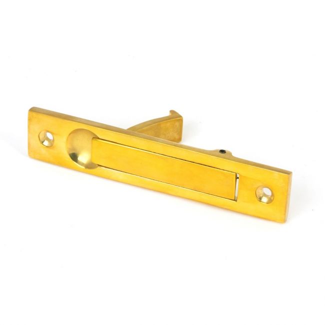 The Retractable Sliding Pocket Door Edge Pull in Polished Brass Shown Laying on its Side on a White Background