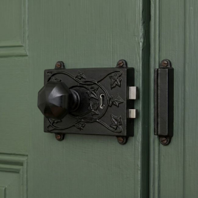 The Reversible "Brackenthorpe" Ornate Black Iron Rim Lock Shown Fitted on a Contemporary Wooden Door - Digital Illustration The Reversible "Brackenthorpe" Ornate Black Iron Rim Lock Shown Fitted on a Contemporary Wooden Door - Digital Illustration