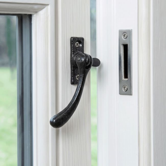 The Reversible Simplistic Black Iron Casement Fastener Displayed on a White Painted Window Frame in an Open Position - Digital Illustration 