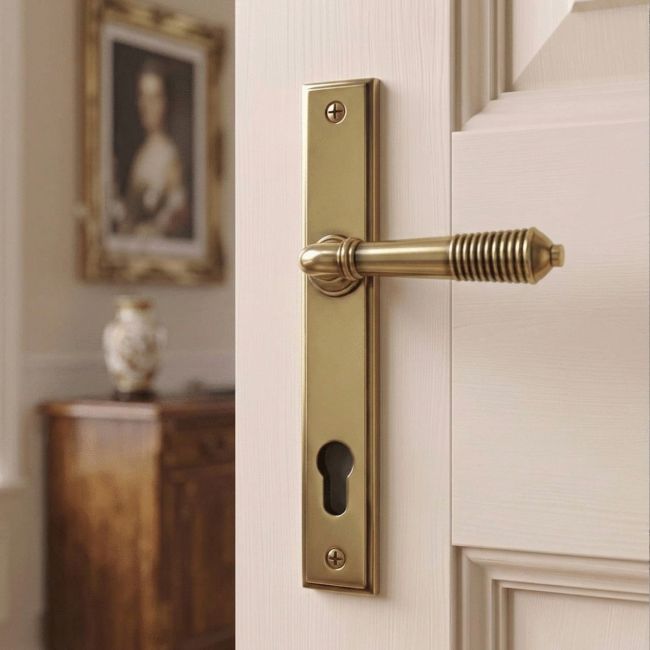 Ribbed Slimline Exterior Door Handle in an  Aged Brass Finish