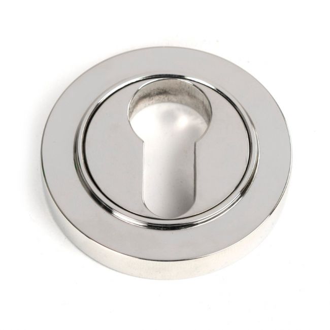 The Round Concealed Euro Keyhole Escutcheon in Polished Stainless Steel Shown on a White Background