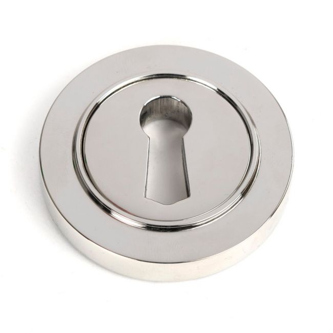 The Round Concealed Standard Keyhole Escutcheon in Polished Stainless Steel Shown on a White Background