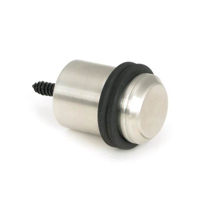 The Satin Stainless Steel Cylindrical Floor Mounted Door Stop on a White Background The Satin Stainless Steel Cylindrical Floor Mounted Door Stop on a White Background