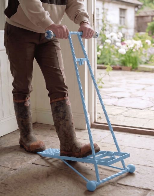 The Sky Blue Glenmore Sky Boot Jack Shown Being Used in a Rustic Cottage Porch Entrance - Digital Illustration The Sky Blue Glenmore Sky Boot Jack Shown Being Used in a Rustic Cottage Porch Entrance - Digital Illustration