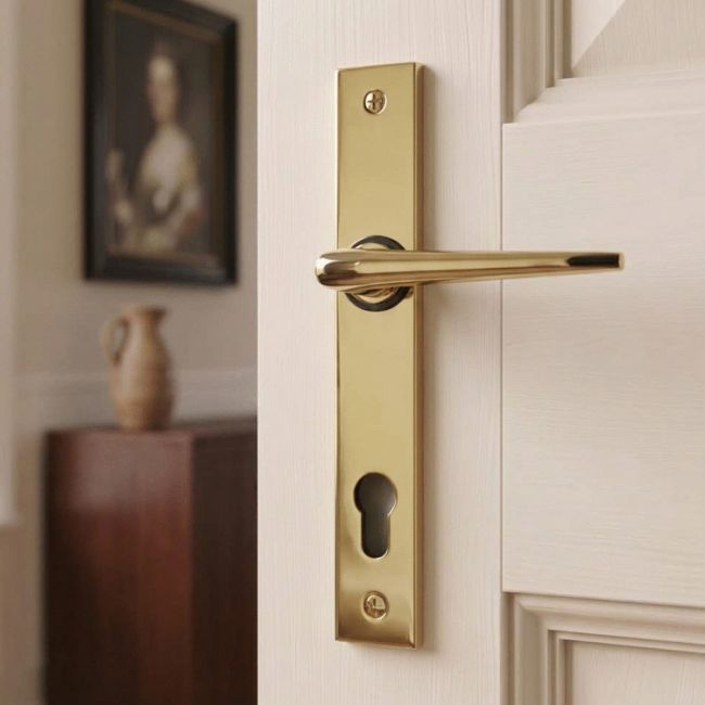 The Aged Brass Slimline Espag Lever Door Handle (92mm Centres) Shown from the Front