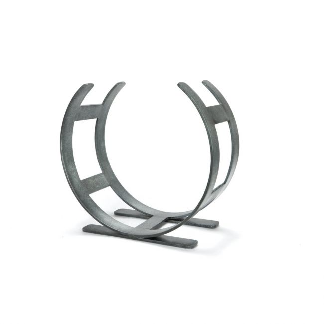 The Small Curved Fireside Log Holder in Pewter Shown from an Angle on a White Background