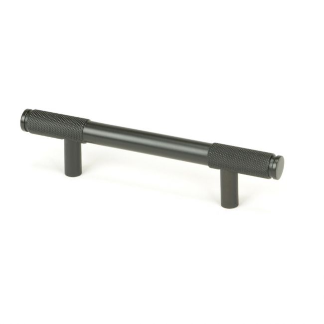 The Small Half Knurled Cabinet Pull Handle in Aged Bronze Shown Upright on a White Background The Small Half Knurled Cabinet Pull Handle in Aged Bronze Shown Upright on a White Background