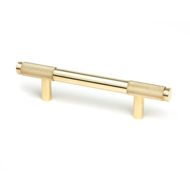 The Small Half Knurled Cabinet Pull Handle in Polished Brass Shown Upright on a White Background