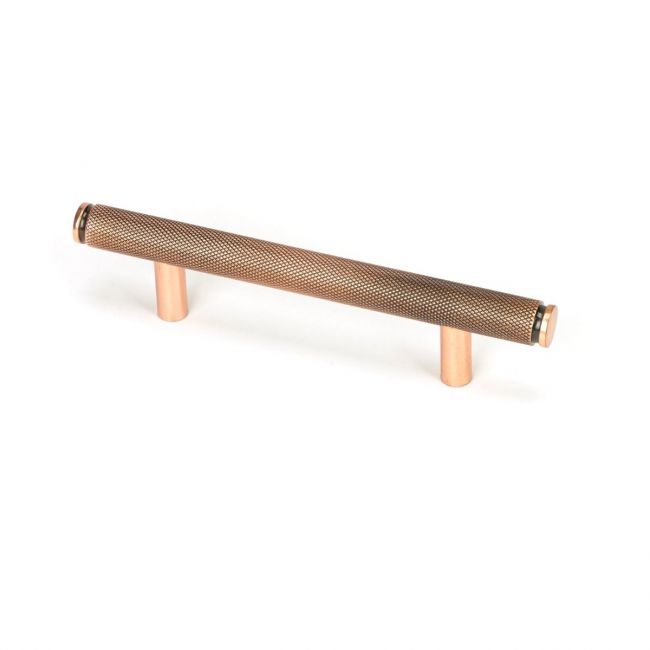 The Small Knurled Cabinet Pull Handle in Polished Bronze Shown Upright on a White Background