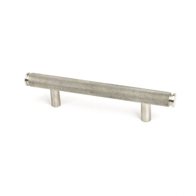 The Small Knurled Cabinet Pull Handle in Satin Stainless Steel Shown Upright on a White Background The Small Knurled Cabinet Pull Handle in Satin Stainless Steel Shown Upright on a White Background