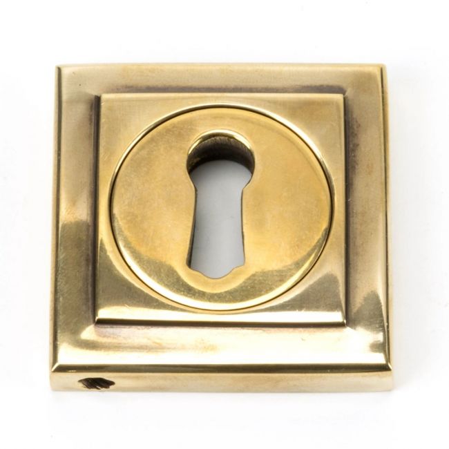 The Square Concealed Standard Keyhole Escutcheon - Aged Brass on a White Background The Square Concealed Standard Keyhole Escutcheon - Aged Brass on a White Background