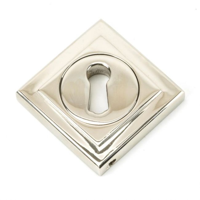The Square Concealed Standard Keyhole Escutcheon - Polished Nickel on a White Background in a Diamond Orientation The Square Concealed Standard Keyhole Escutcheon - Polished Nickel on a White Background in a Diamond Orientation