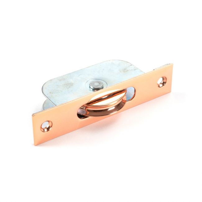 The Square Ended Sash Window Pulley (75kg) in Polished Bronze Shown on its Side on a White Background The Square Ended Sash Window Pulley (75kg) in Polished Bronze Shown on its Side on a White Background