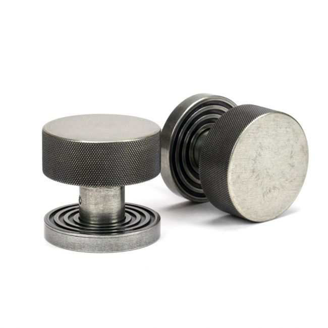 The Knurled Mortice/Rim Knob Set on a Beehive Rose in Pewter Shown Upright and on its Side The Knurled Mortice/Rim Knob Set on a Beehive Rose in Pewter Shown Upright and on its Side
