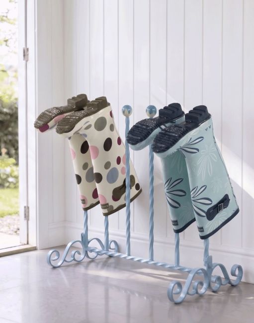 The Thirbeck Three Pair Sky Blue Boot Rack Placed in a Sunny Cottage Porch Entranceway - Digital Illustration The Thirbeck Three Pair Sky Blue Boot Rack Placed in a Sunny Cottage Porch Entranceway - Digital Illustration