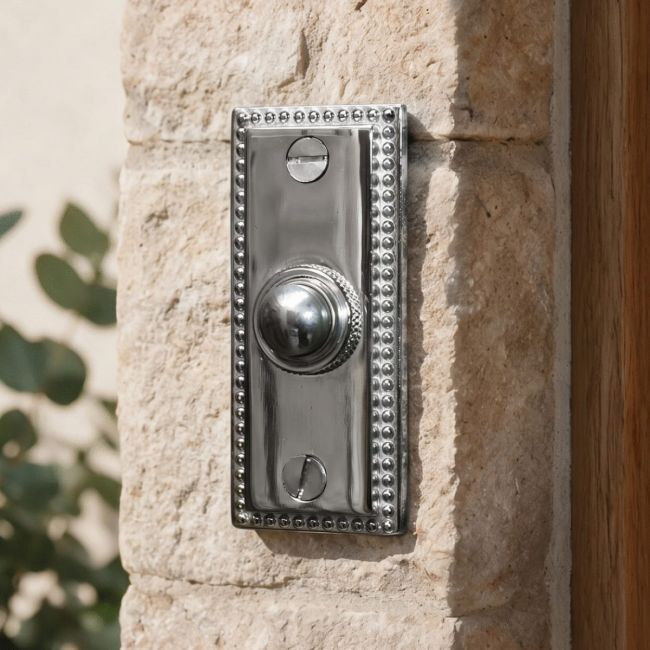 Georgian bell push on brick wall finished in bright chrome Georgian bell push on brick wall finished in bright chrome