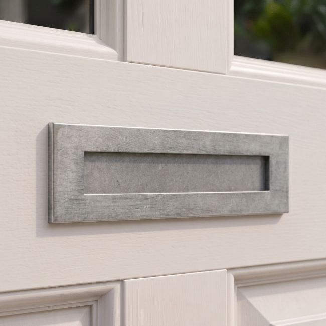 The Traditional 12 Inch Front Door Letter Plate with Antique Period Style Flap in a Pewter Finish on a Front Door on a Period Property - Digital Illustration The Traditional 12 Inch Front Door Letter Plate with Antique Period Style Flap in a Pewter Finish on a Front Door on a Period Property - Digital Illustration