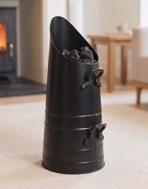 The Traditional "Norfolk" Coal Hod Filled with Coal in a Cream Living Room Interior - Digital Illustration The Traditional "Norfolk" Coal Hod Filled with Coal in a Cream Living Room Interior - Digital Illustration