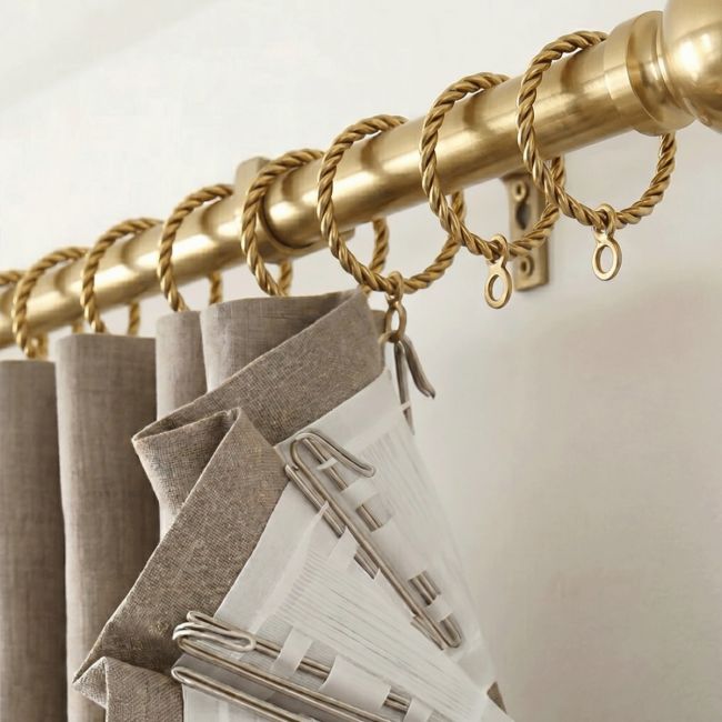 The Twisted Brass Curtain Rings in a Golden Coloured Finish Attached to a Matching Curtain Pole Supporting a Curtain - Digital Illustration 