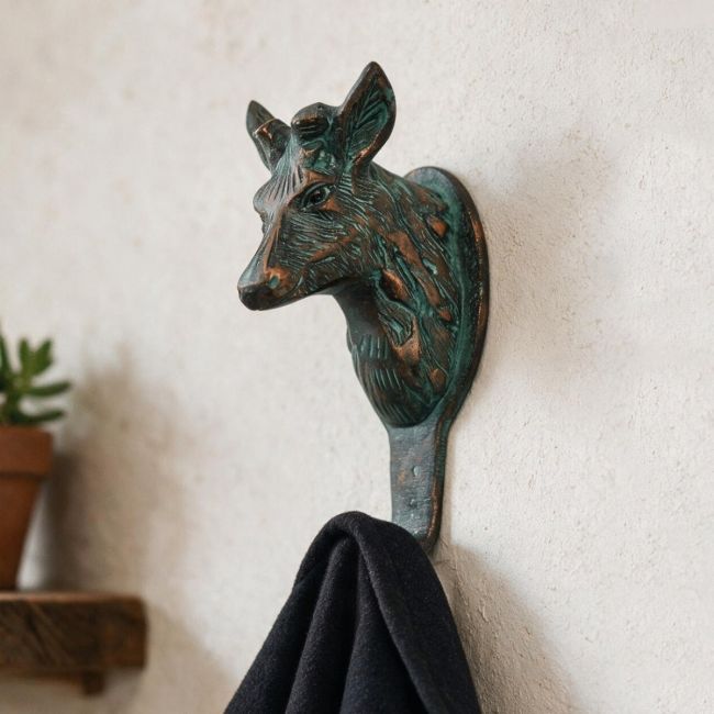 The Verdigris Deer Hook on a Sand coloured Interior Wall in a Entrance Hallway - Digital Illustration The Verdigris Deer Hook on a Sand coloured Interior Wall in a Entrance Hallway - Digital Illustration