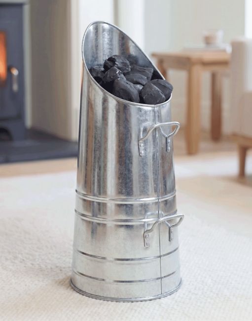 The Zinc Traditional Coal Hod in a Contemporary Living Room with a Fire place in the background - Digital Illustration