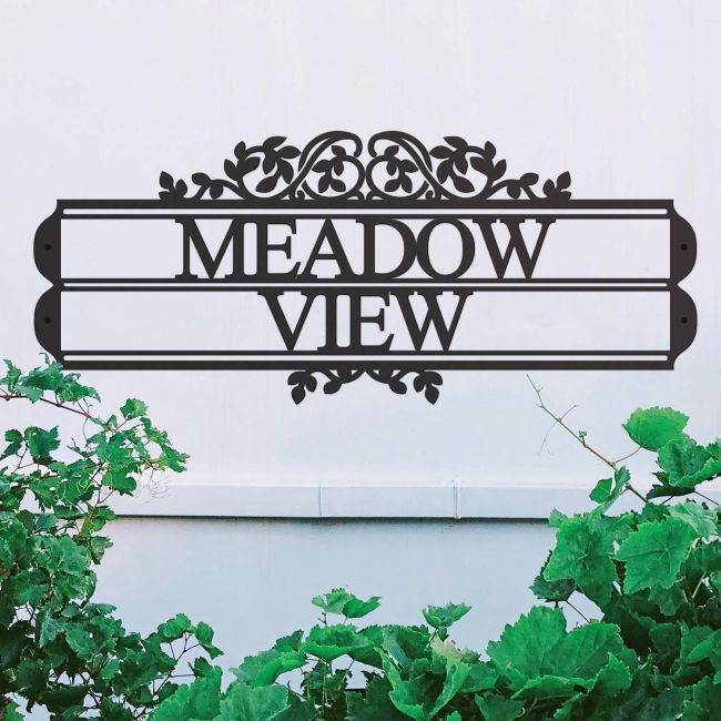 Traditional Foliage House Name Sign in Situ on a White Wall Traditional Foliage House Name Sign in Situ on a White Wall